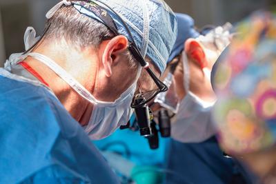 Thomas MacGillivray and a team of surgeons performs a surgical procedure at MedStar Health.