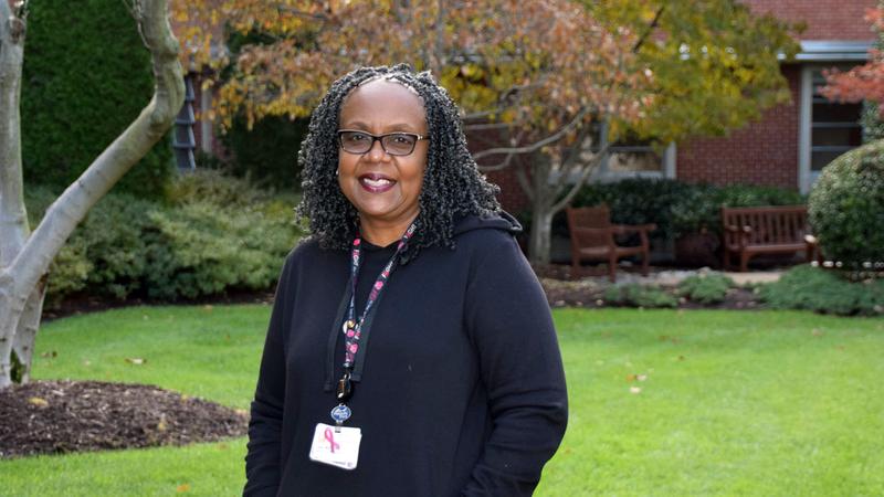 Lynel McFadden, breast cancer survivor and former MedStar Health patient, stands outdoors and poses for the camera.