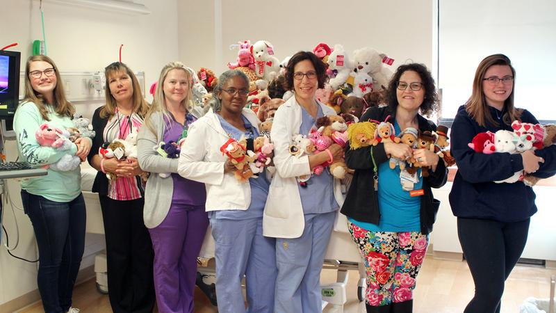 Nurses and staff from MedStar Southern Maryland Hospital Center hold some of the many stuffed animals they have for elderly and pediatric patients.