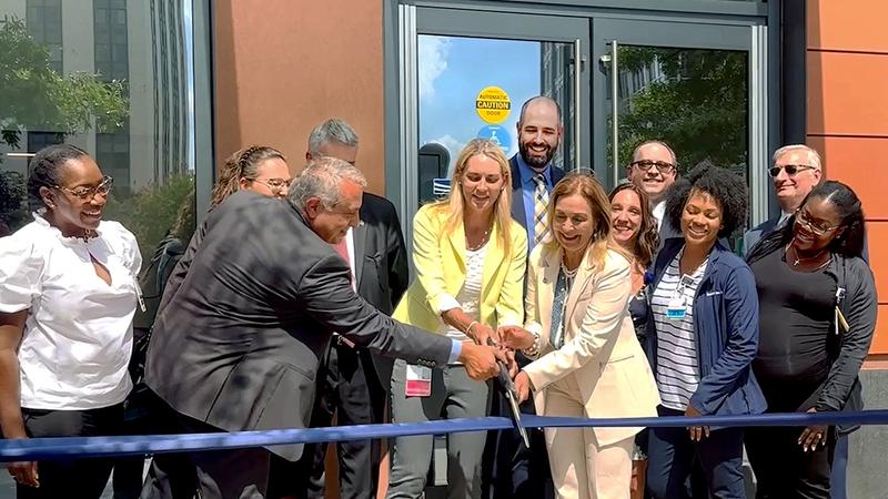 Dr Bronson Delasobera cuts the ribbon in a ceremony at the new MedStar Health Urgent Care location at Ballston, in Alexandria, VA on Monday September 11, 2023.