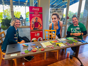 Nurses from the Medstar Health wellbeing team at an information display table.