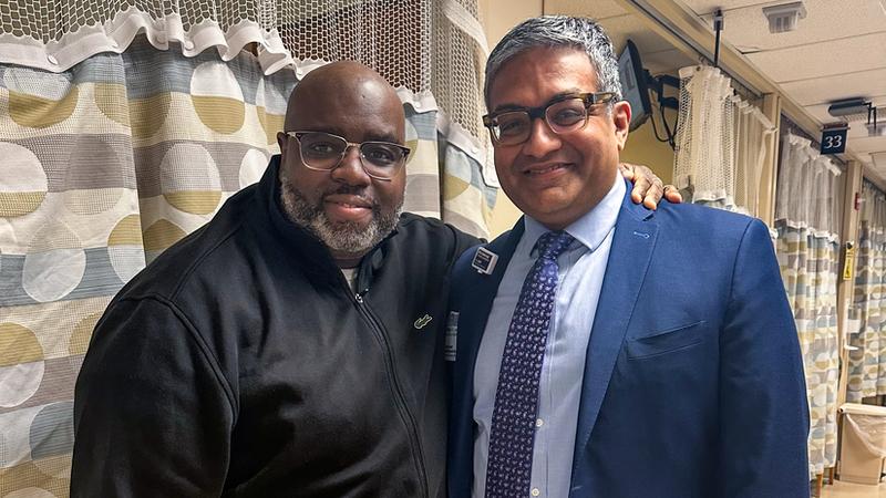 Paul Saunders stands with Dr Raghuveer Vallabhaneni, who removed Saunders' pulmonary embolism during a procedure at MedStar Harbor Hospital.