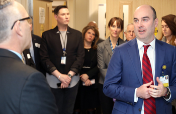 Dr. Shane Kappler welcomes guests from HHS to tour the biocontainment unit at MedStar Washington Hospital Center.