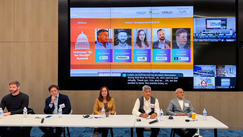 Participants listen to a panel discussion during the Universal “AI for Health” Summit