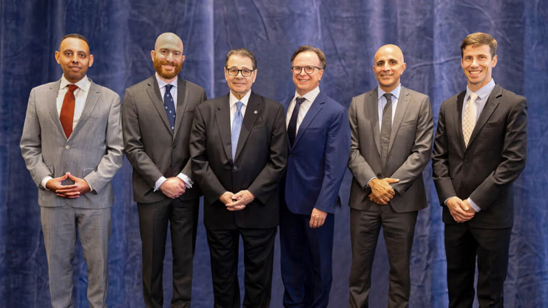 A group of orthopedic surgeons from MedStar Health pose for a group photo.