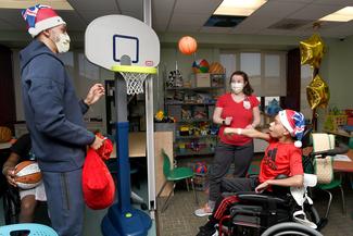 Wizards Visit_MNRH patient E.J. Smith shooting basketball-2.jpg