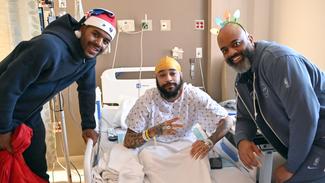 Wizards Visit_MWHC Jared Butler and Head Coach Wes Unseld Jr with patient-2.jpg