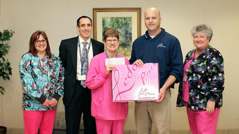 Cancer Care and Infusion Services (CCIS) at MedStar St. Mary’s Hospital receives a donation check from Ledo Pizza’s corporate office in Annapolis, Maryland.