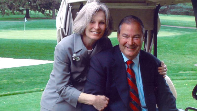 MNRH founder Ed Eckenhoff with his wife pictured on a golf course.