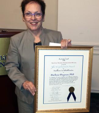 Barbara Bregman holds her 28th Annual John W. Goldschmidt Award