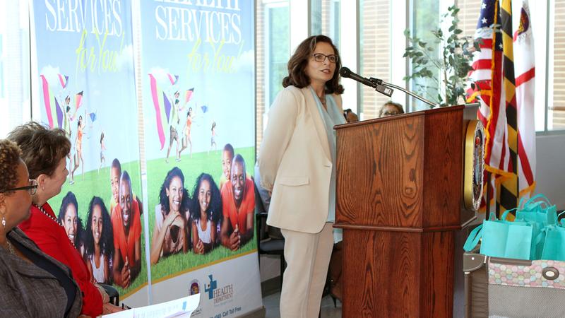 Dr Nahid Mazarei speaks at a podium during a press conference for the Healthy Babies Initiative at MedStar Health.