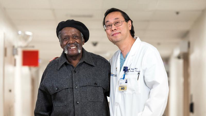 Dr Mun Hong stands together with a patient inside a MedStar Health hospital.