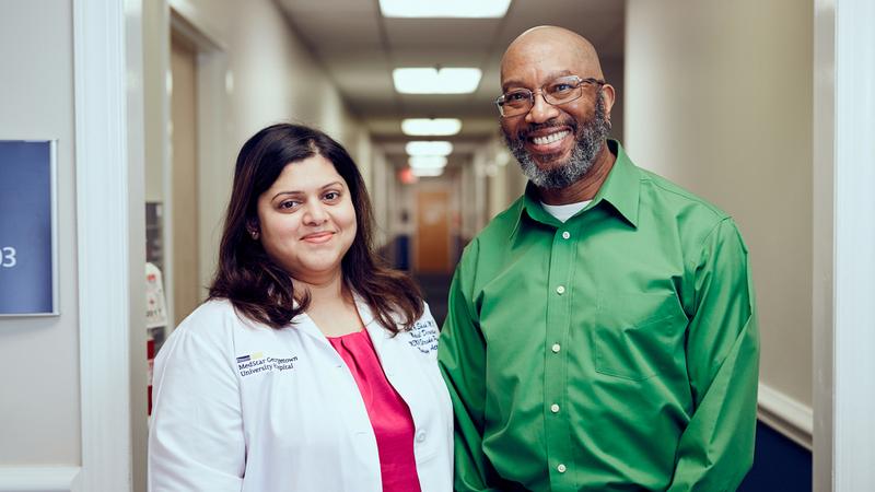 Dr Aabha Shah and her patient Adrian Knight stand together for a photo after Mr Knight was treated for stroke.