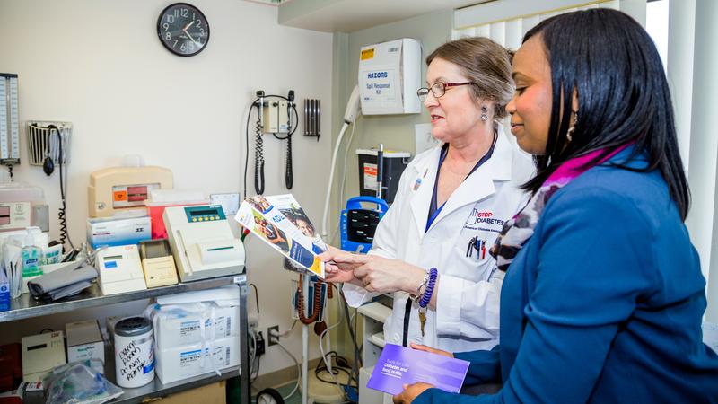 Dr Michelle Magee talks with a patient.