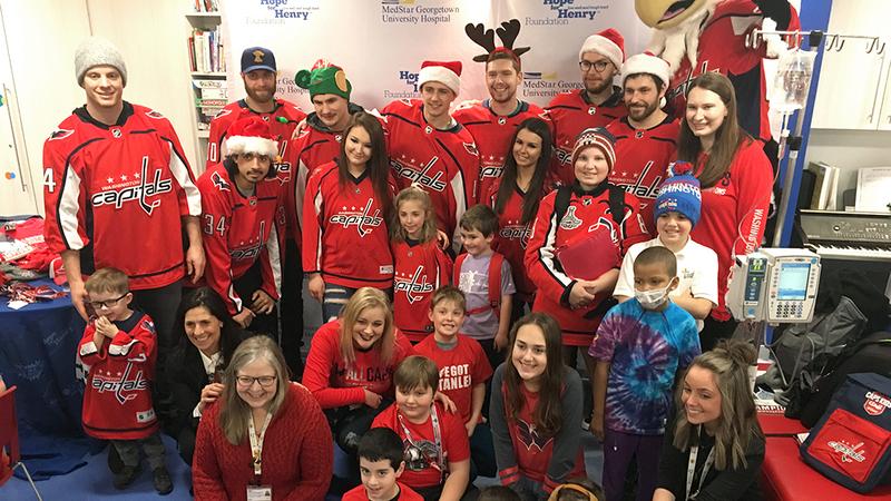Washington Capitals players pay a visit to a young patient at a MedStar Health Hospital.