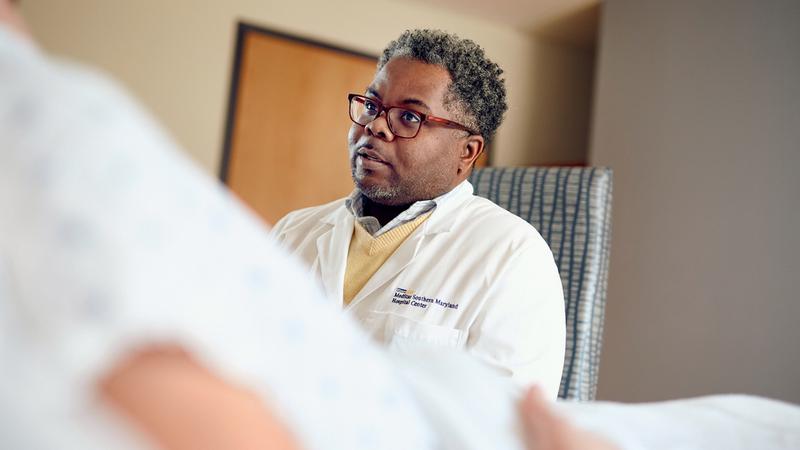 Dr Alvin Reaves visits a patient at MedStar Southern Maryland Hospital Center.