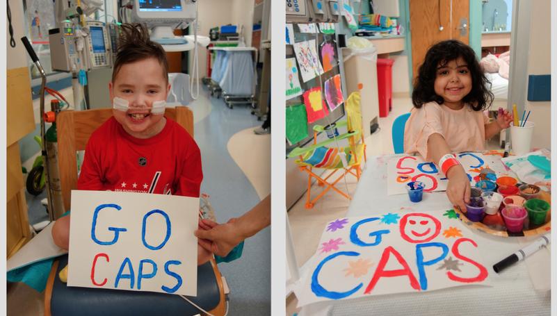 Young hospital patients hold signs saying "Go Caps".