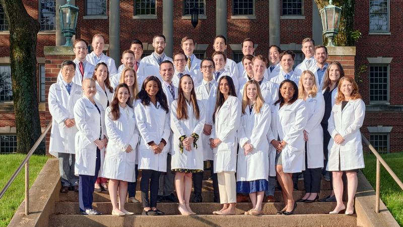 A group of residents and faculty from the MedStar Health Otolaryngology Head and Neck Residency program stand together for a group photo outdoors.