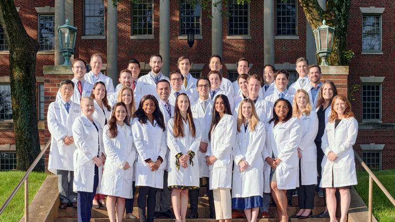 A group of residents and faculty from the MedStar Health Otolaryngology Head and Neck Residency program stand together for a group photo outdoors.