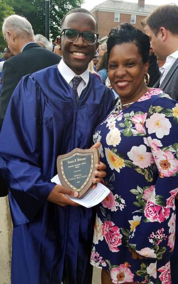 Austin Williams with his mother at his high school graduation.