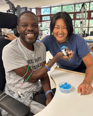 Curtis Thomas with occupational therapist Emily Costa at MedStar Health.