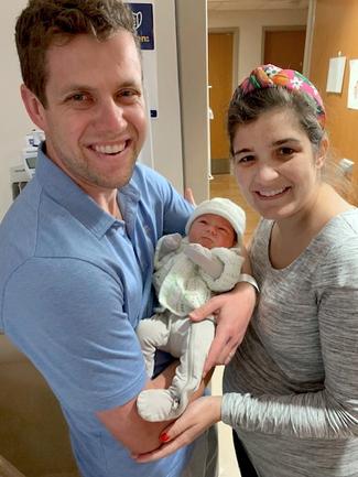Melissa Giaimo Cotton with her husband and newborn son, Nicolas.