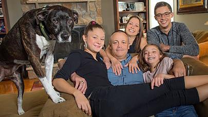 The Pope family sits together for a family portrait after the father, James, underwent a successful liver transplant.