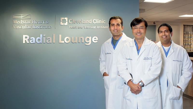 A group of interventional cardiologists pose for a photo in the radial lounge at MedStar Union Memorial Hospital.