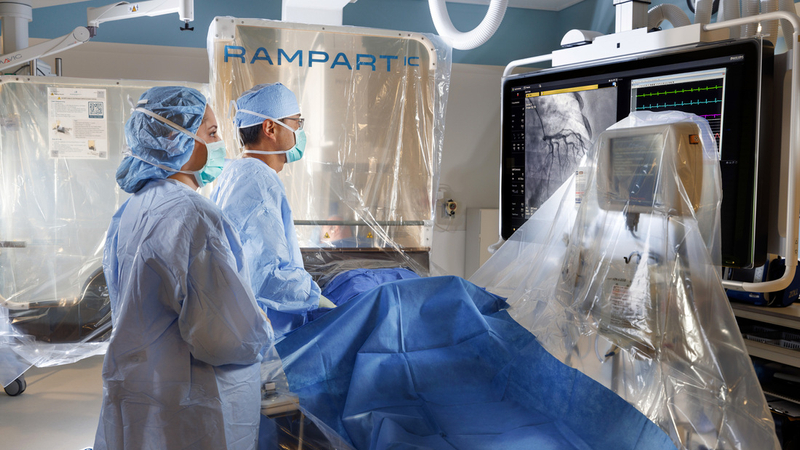 Doctors perform a heart surgery procedure using the Rampart IC radiation protection screen to limit surgeons' exposure to radiation.