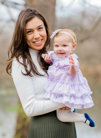 Hanna Sheenstra hold the baby whose life she saved by donating part of her liver in order to perform a life-saving transplant.