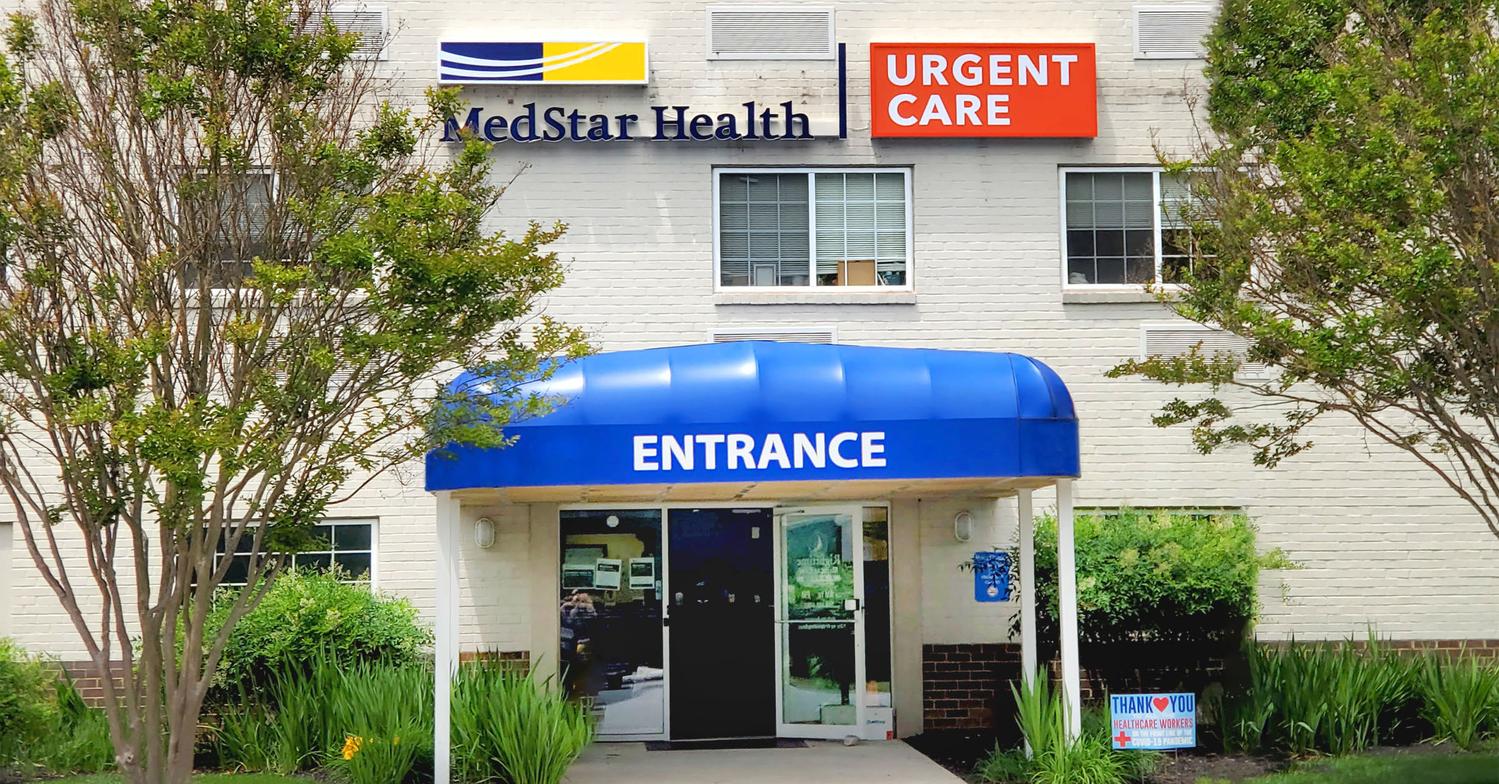 Front entrance with blue awning at MedStar Health urgent care center in Columbia, Maryland