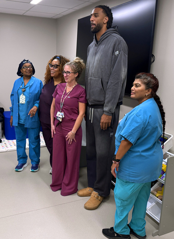 Alex Sarr, from the Washington Wizards, tours a new pediatrics unit at MedStar National Rehabilitation Hospital.