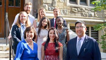 Adult Psychiatry Residency program residents stand together on a stairway.