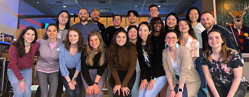 Adult Psychiatry Residency program residents stand together on a stairway.