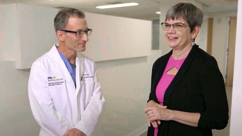 Dr. Steven Potter talks with living donor Anne Hughes.