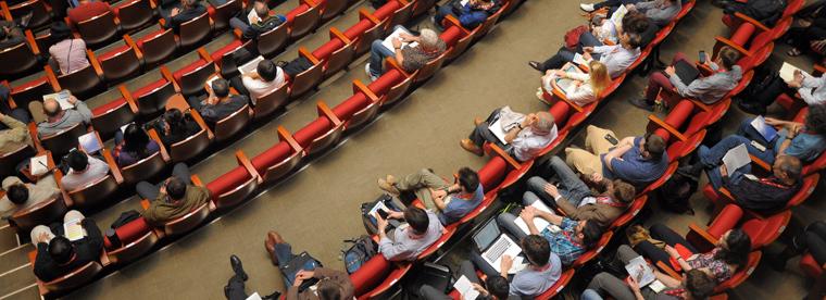 Overhead photo of audience members during a presentation.