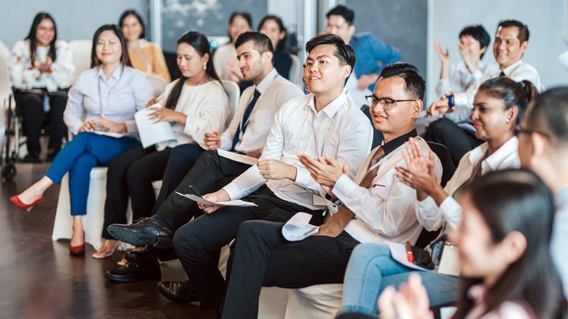 An audience listens to a presentation.