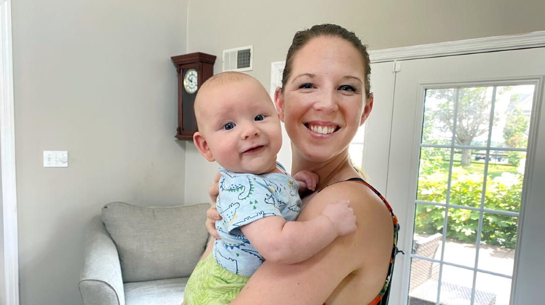 Diabetes Educator Shayna Frost holds her newborn baby.