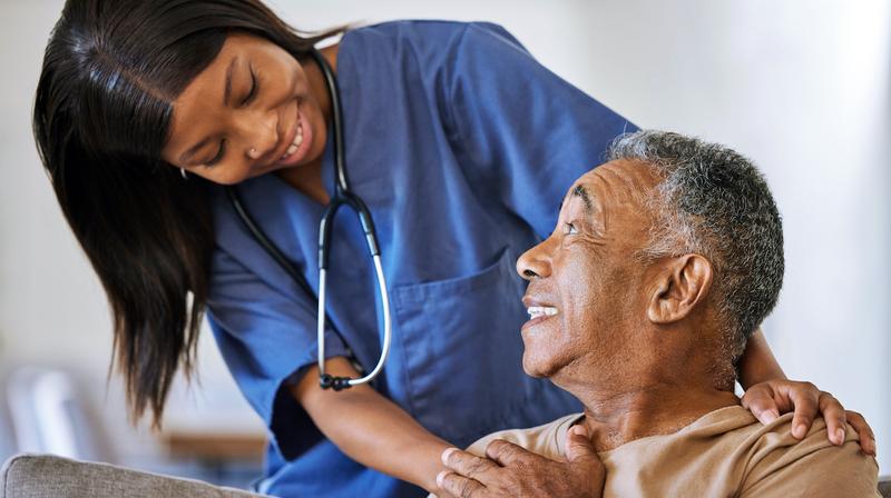 A nurse cares for an elderly patient.