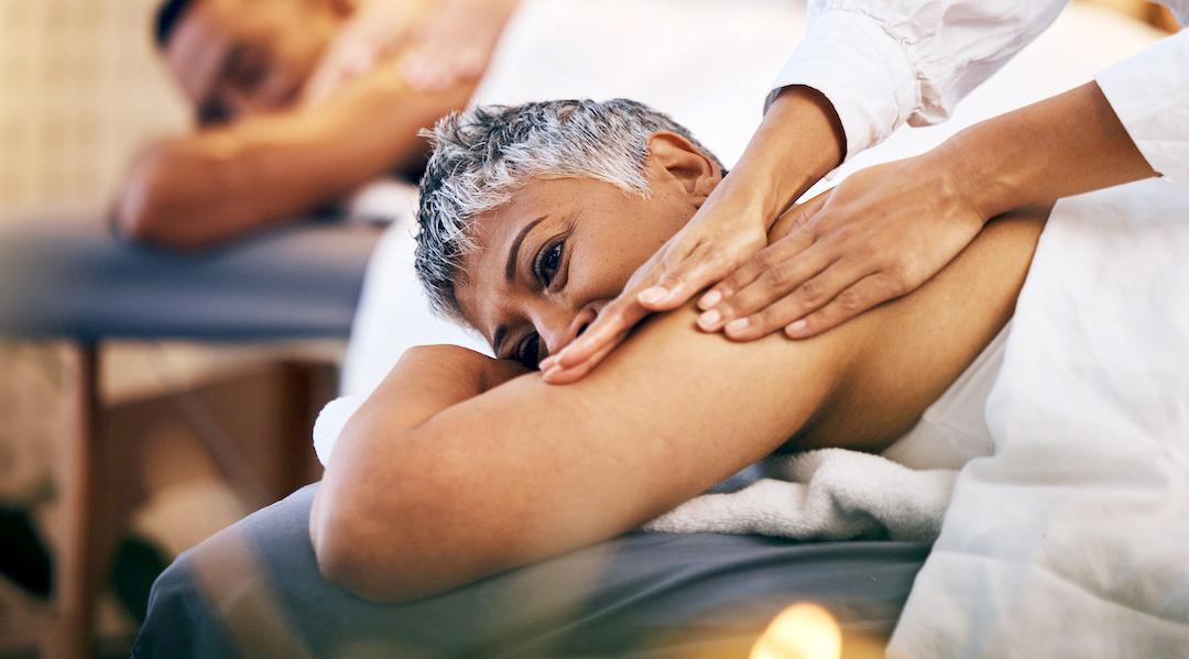 An adult woman received a theraputic massage.