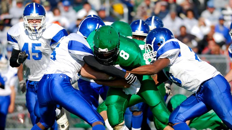 Football players on the field during a game.