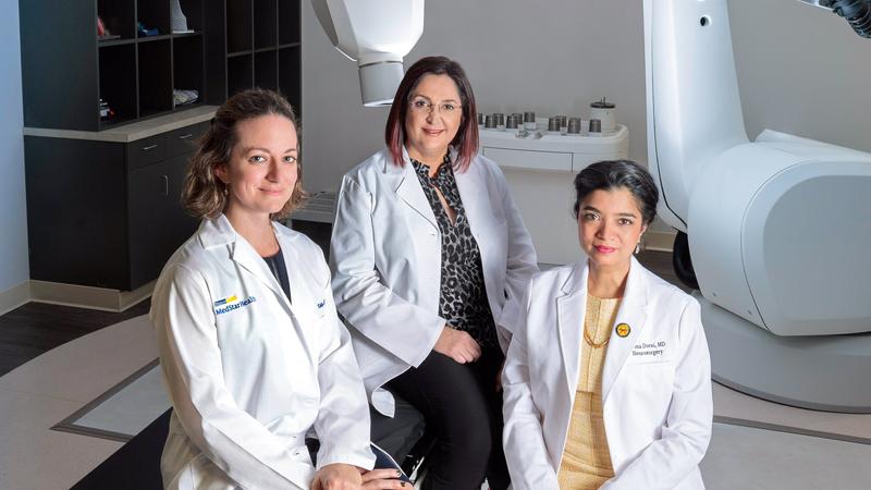 Doctors Orwat, Mohebtash and Dorai pose for a photo in the Cyberknife Center at MedStar Health.