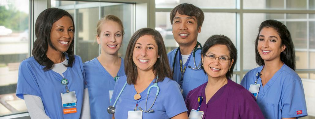 A group of nurses from MedStar Health poses for a photo in a hospital setting.