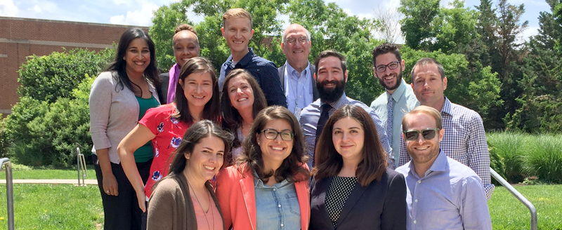 Child and Adolescent Psychology fellowship graduates pose for a group photo outdoors.