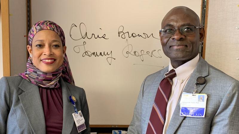 MedStar Chaplain Tamara Akmal and Emmanuel Saidi, Director of Spirtual Care for MedStar Washington Hospital Center, pose for a photo indoors.