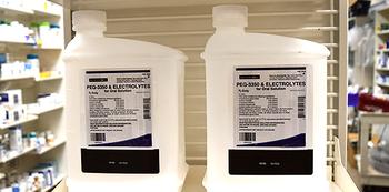 Closeup photo of bottles of colonoscopy prep liquids on a pharmacy shelf.