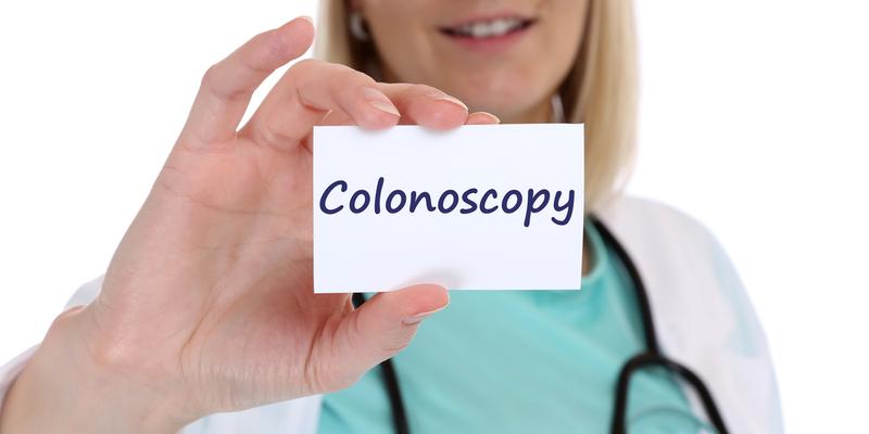 Colonoscopy cancer prevention screening check-up disease ill illness nurse doctor with sign