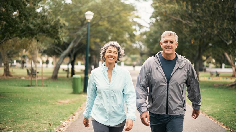 Portrait of a senior couple out for a walk in the park