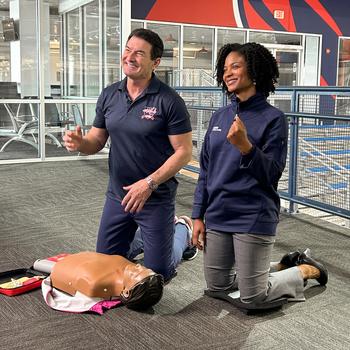 Jennifer Thompson, MD, an emergency physician for MedStar Health appears with retired Washington Capitals player Alan May.