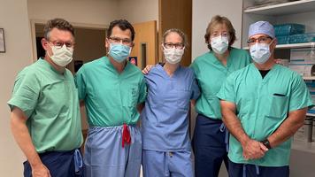 A group of faculty members from MedStar Health's Sports Medicine Fellowship Program pose for a photo. They are wearing masks.